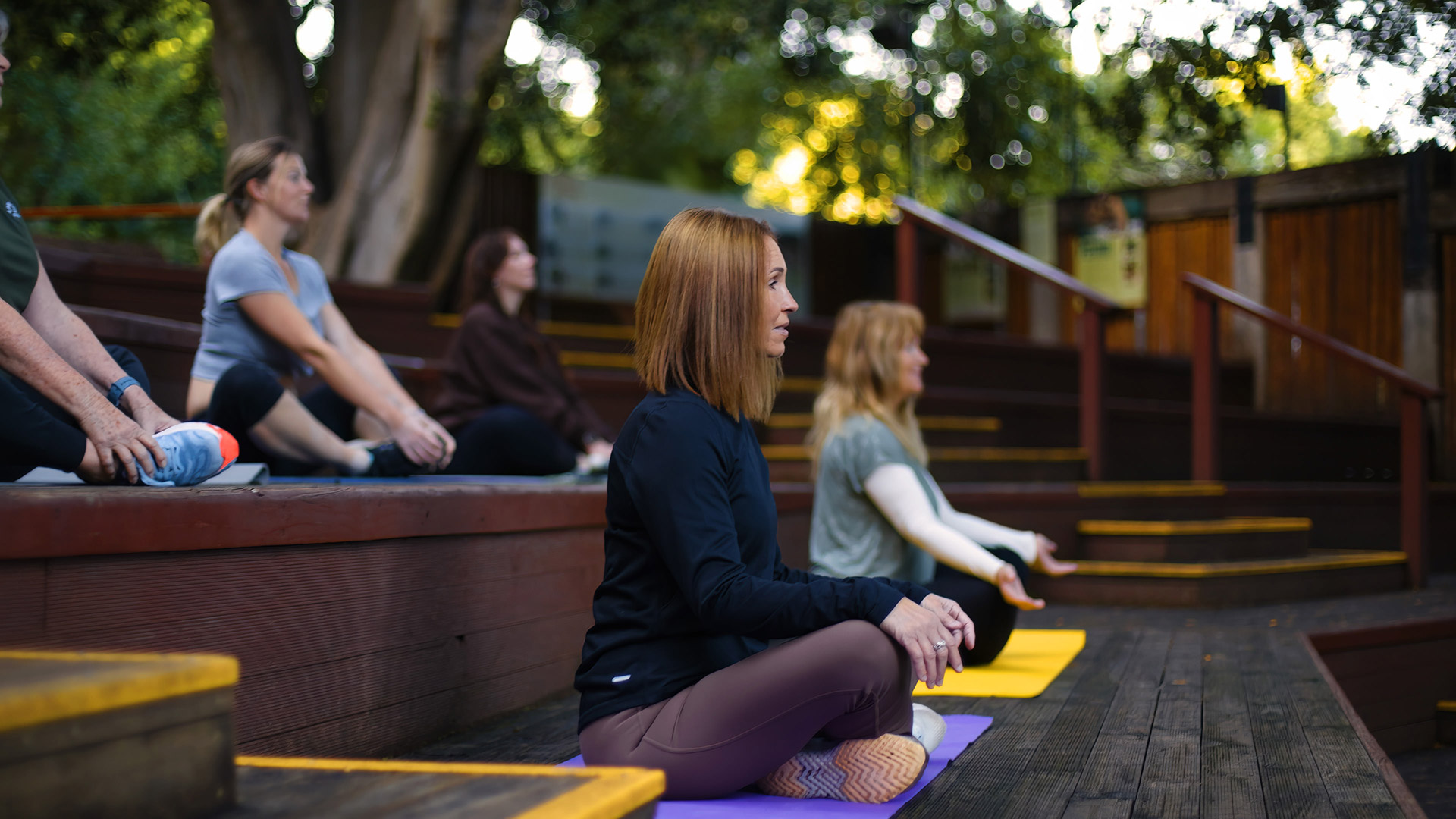 Corporate wellness session in Perth with guided outdoor meditation for workplace wellbeing