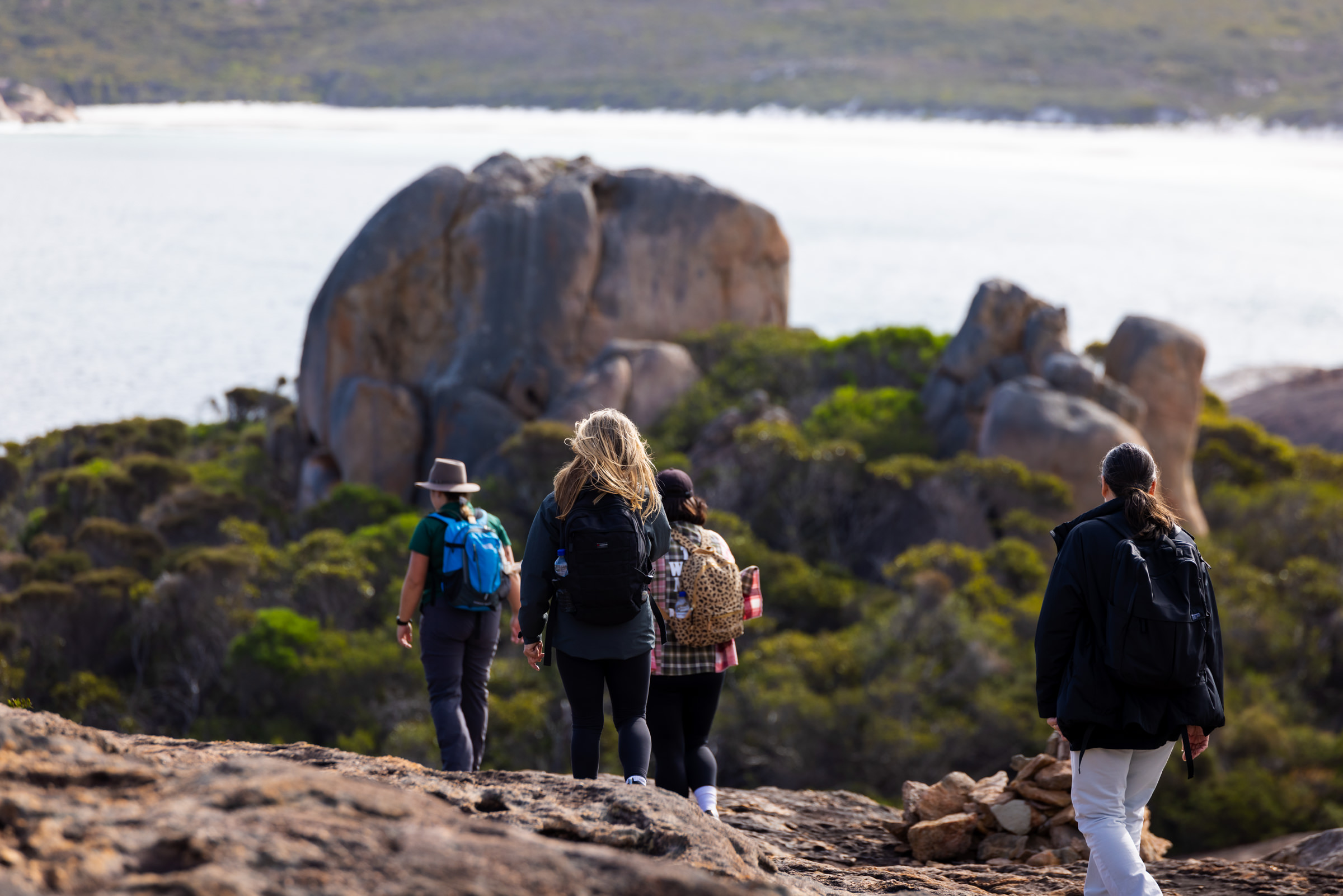 Group hiking experience in Esperance Western Australia with coastal views and granite rock formations
